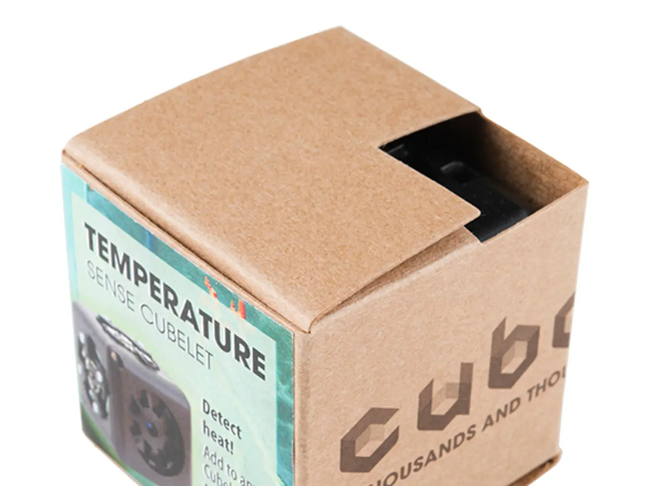 In this picture, we see a shipping box. We see a poster in light green color is pasted on the box....