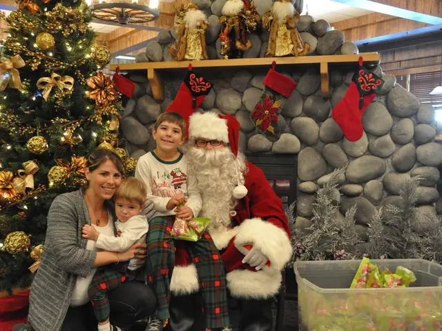 There is a lady, children and a man in santa claus dress. Man is wearing specs and gloves. Boy is...