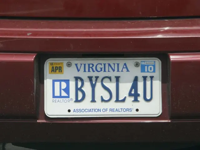 White board is on the red vehicle. Something written on this white board.