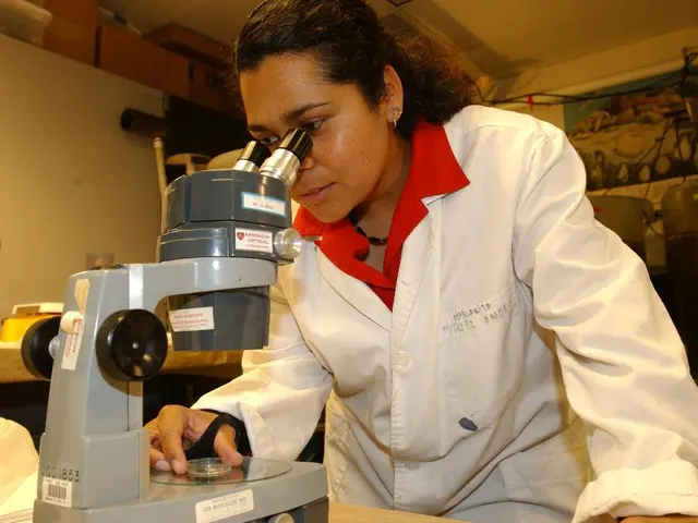 In the picture I can see a woman on the right side is wearing a white coat and she is holding a...