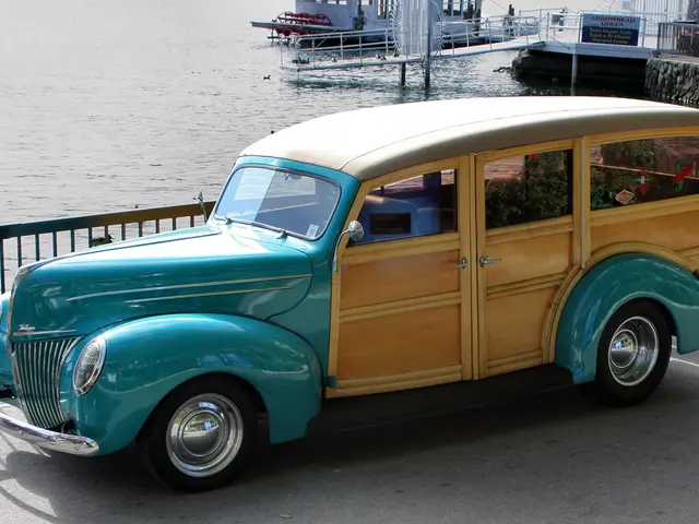 In this picture I can see vehicles on the road, there are iron grilles, there is a boat on the...