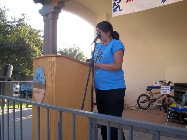 As we can see in the image there are trees, sky, cars, banner, small bicycle and a woman over here....