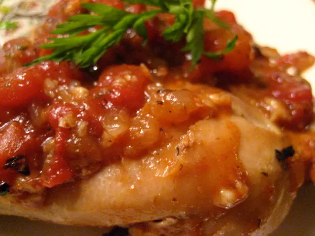 There are leaves on a food item, on which there are some ingredients. And the background is white...