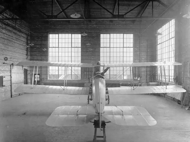 In the middle of this image, there is an aircraft arranged on the floor of a building, which is...