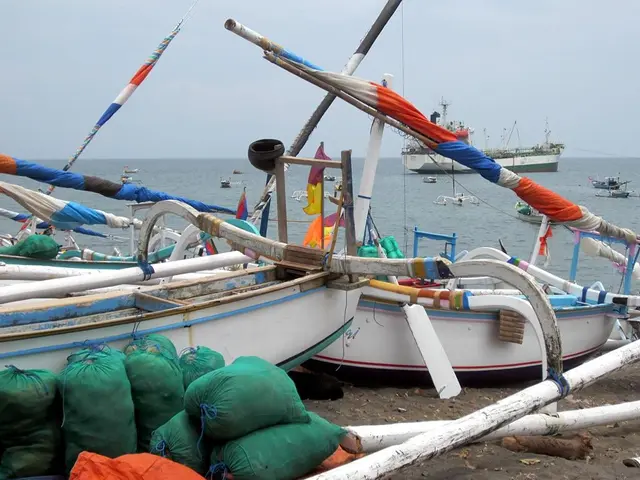 This picture shows few boats in the water and a cloudy sky and we see few boats on the seashore and...